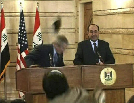 Muntadar al-Zeidi attacks George W. Bush with a shoe