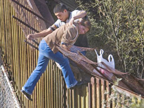 Fence on Mexican border being crossed illegally